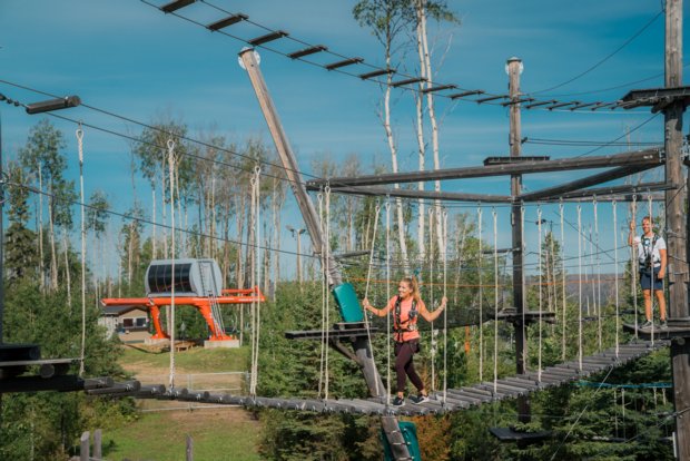 Couple on outdoor adventure course at Vista Ridge in Fort McMurray.