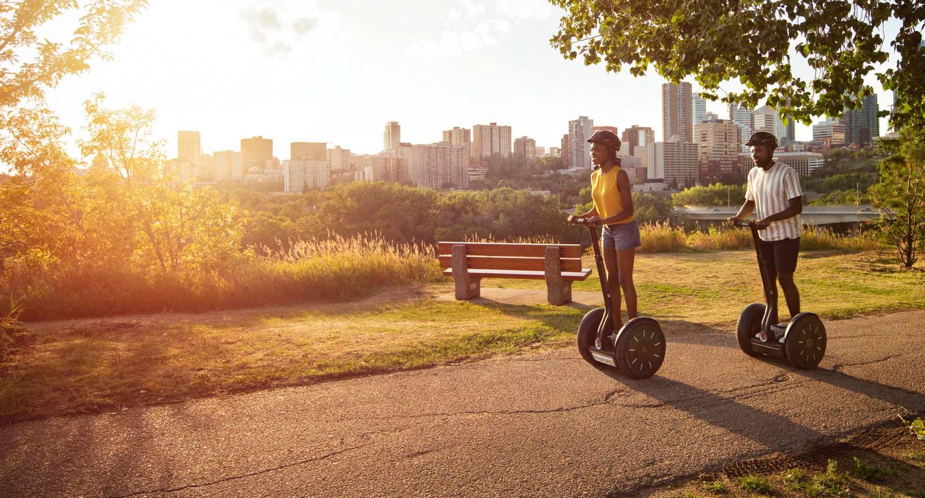 Two people riding segways in Edmonton's River Valley.