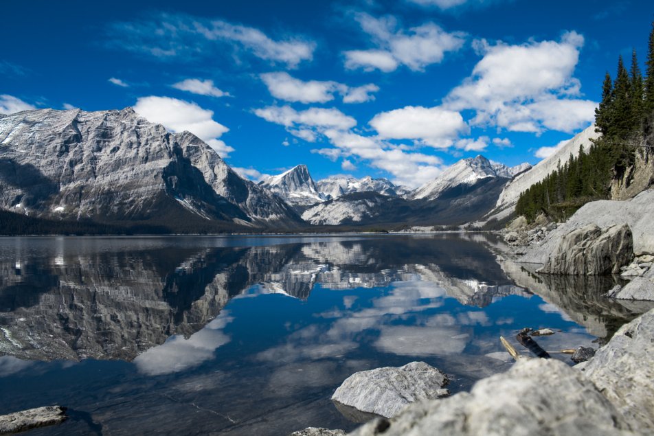 mountain range reflection upon a lake
