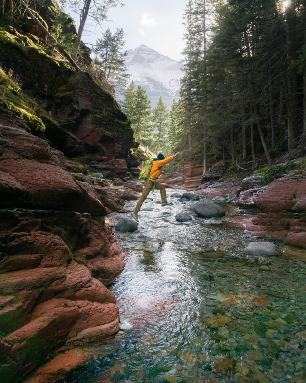 Hiker jumping over rocks at Red Rock Canyon