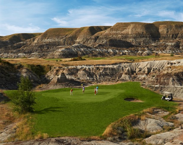People golfing at the Dinosaur Trail Golf & Country Club in Drumheller.