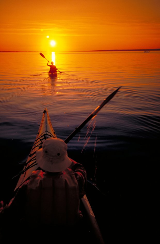 Kayakers paddle into the sunset on Lesser Slave Lake