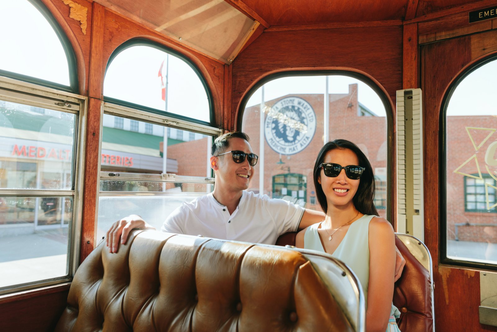 Couple exploring Medicine Hat's historic downtown and riding inside the Medicine Hat Sunshine Trolley.