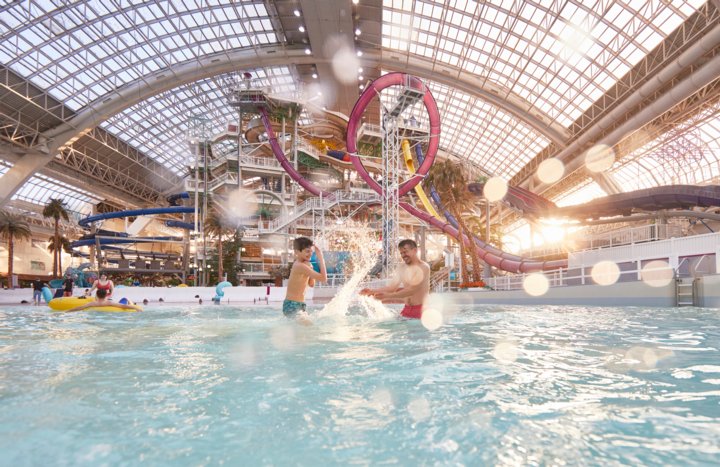 Father and son splashing in the Waterpark at West Edmonton Mall