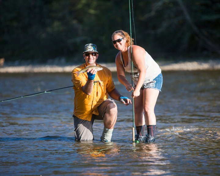 Man and woman posing with caught fish on the Berland River near Whitecourt